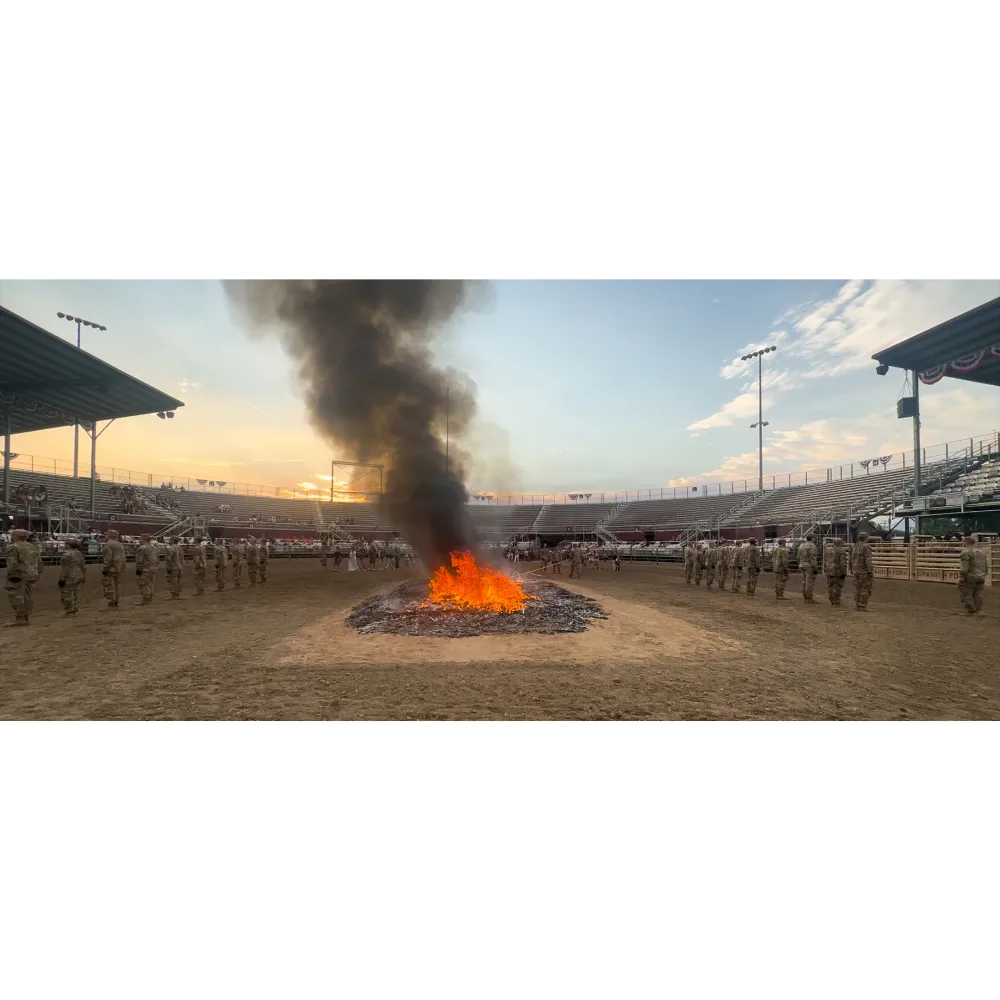 Utah National Guard soldiers, American Legion members, and Boy Scouts retiring worn flags at the Fiesta Days ceremony in Spanish Fork, Utah