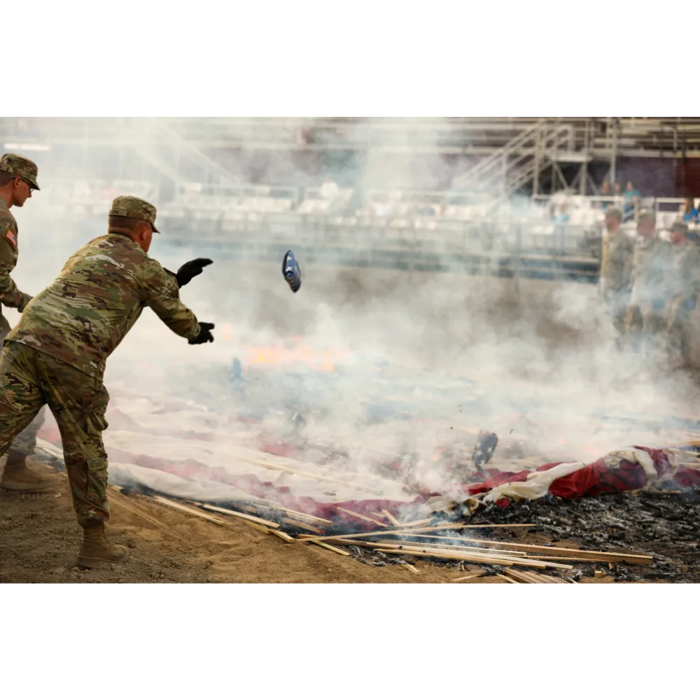 Utah National Guard soldiers, American Legion members, and Boy Scouts retiring worn American flags at a ceremony