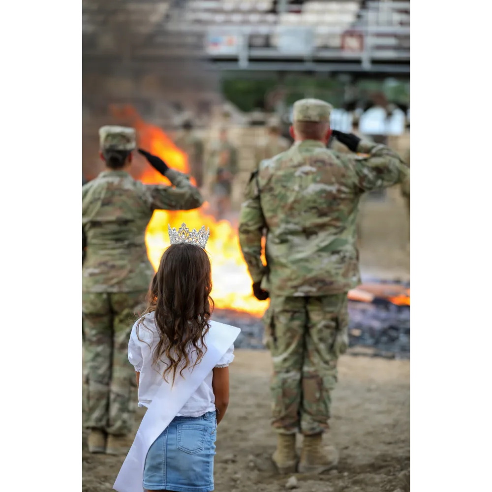 Utah National Guard soldiers, American Legion members, and Boy Scouts retiring worn flags at the Fiesta Days ceremony in Spanish Fork, Utah