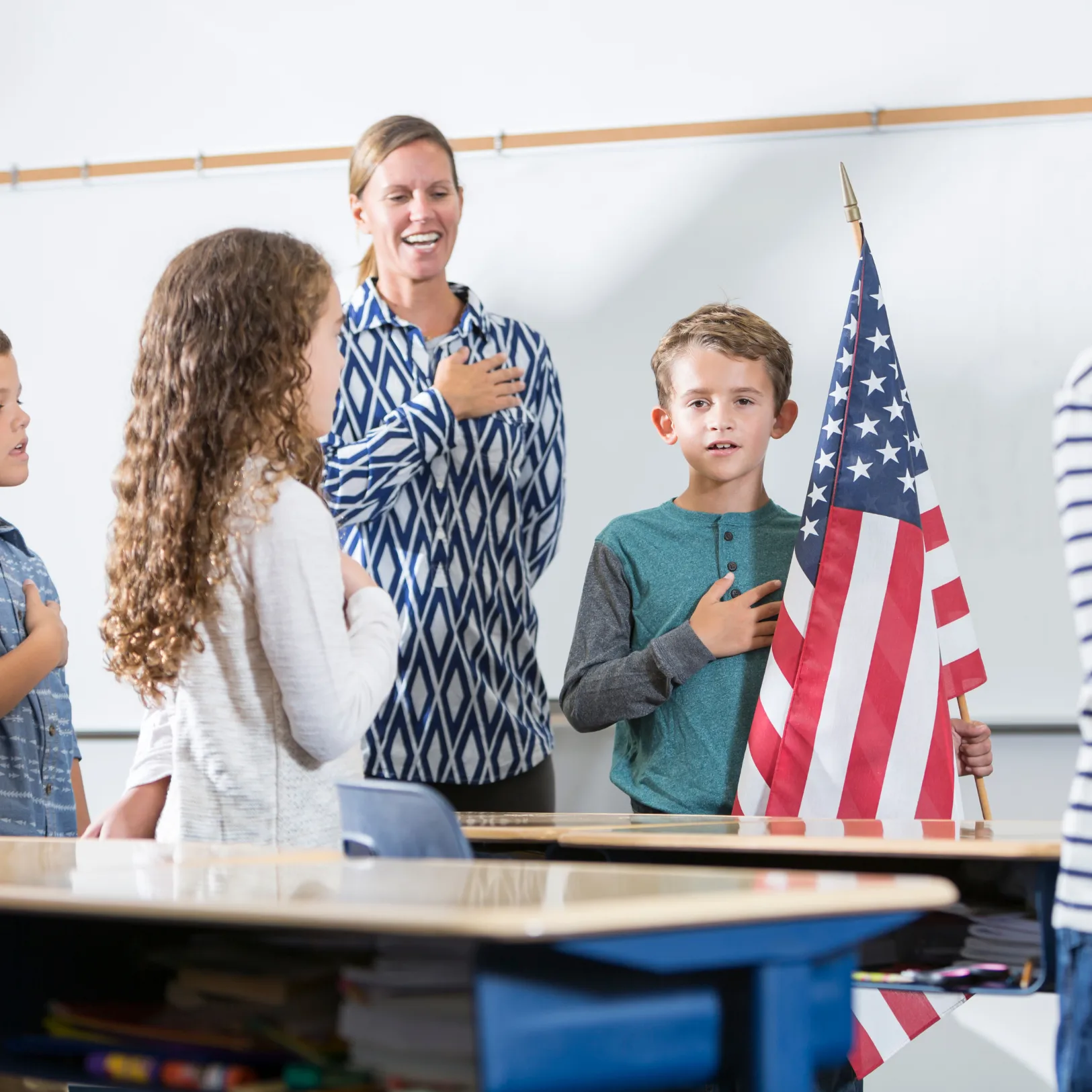 Pledge of Allegiance in a classroom with child students and their teacher
